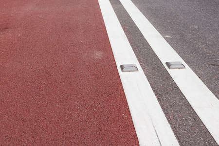 road stud with white reflector and red pathの写真素材