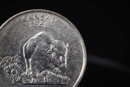 US American coin with wording "KANSAS 1861" on black backgroundの写真素材
