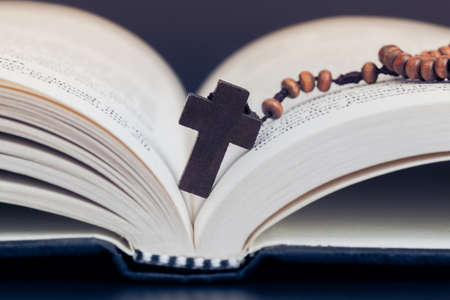 Christian cross necklace on Holy Bible book, Jesus religion concept as good friday or easter...