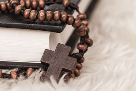 Christian cross necklace on Holy Bible book, Jesus religion concept as good friday or easter festivalの写真素材