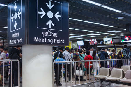 BANGKOK THAILAND - FEBRUARY 17 : The meeting point sign and business crowd or people waiting queue for transportation or taxi at Donmueang International Airport Bangkok, Thailand on February 17, 2015のeditorial素材