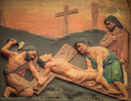 BANGKOK THAILAND - FEBRUARY 28 : The carving of Jesus is nailed to the cross at station XI, good friday concept in church Thailand on February 28, 2015のeditorial素材