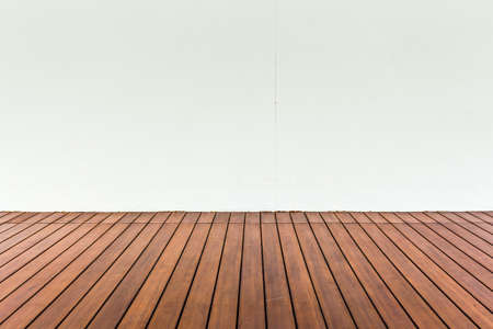 Wood plank floor and white wall, can use as vintage backgroundの写真素材
