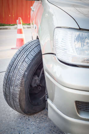 Car crash accident, impact to front wheel axle and bumper is broken cannot drive, insurance conceptの写真素材
