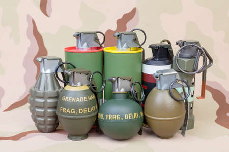 All explosives, weapon army,standard time fuze, hand grenade on camouflage backgroundの写真素材