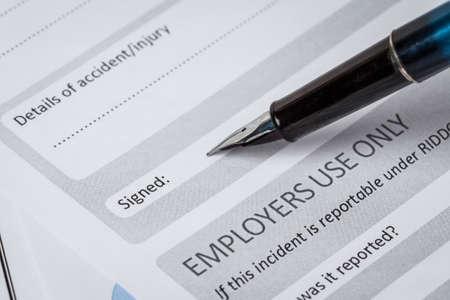 Signature field on document with pen and signed here; document is mock-upの写真素材