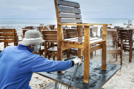 worker or carpenter, splash painted or repair, wooden chairの写真素材