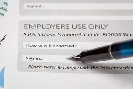 Signature field on document with pen and signed here; document is mock-upの写真素材