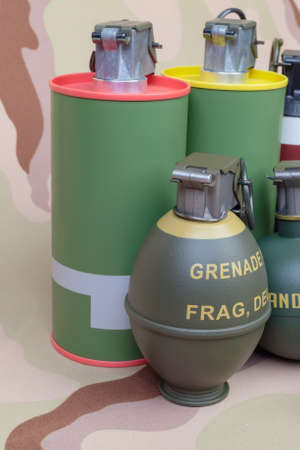 All explosives, weapon army,standard time fuze, hand grenade on camouflage backgroundの写真素材