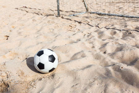 football soccer on sand beachの写真素材