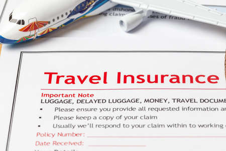 Travel Insurance Claim application form on brown envelope, business insurance and risk concept;...