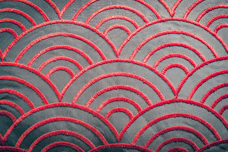 Red color, thread curve pattern texture on textile backgroundの写真素材