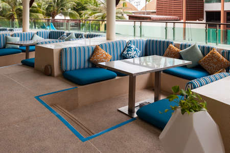 Restaurant dining table and pillow on terrace outsideの写真素材