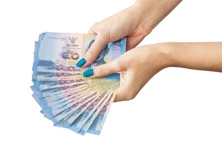 Thai Banknote money in female hand, isolated on white backgroundの写真素材