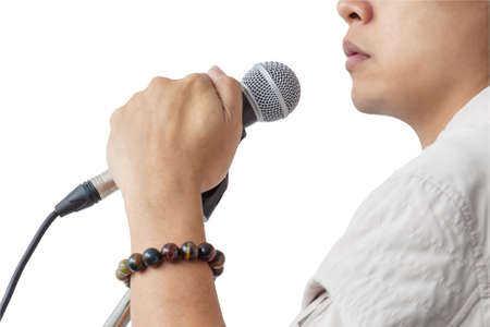 Man and hand holding Microphone stand sing song isolated on white background, closeupの写真素材