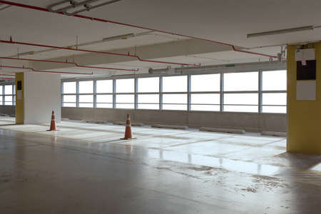 Empty car parking line  with red cone and white windows, can use as backgroundの写真素材