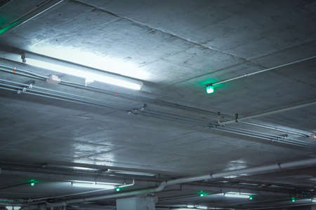 car parking light sign, inform the rest of car park installed at ceiling backgroundの写真素材