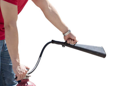 Man hand using fire extinguisher with head spray, safety concept isolated on white backgroundの写真素材
