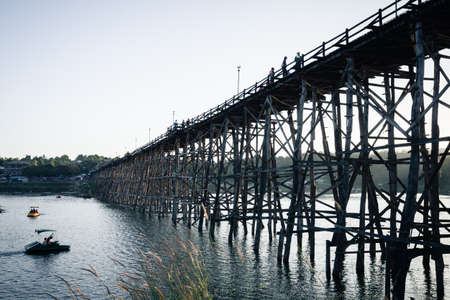 Utamanusorn Bridge Mon Bridge, made from wooden for across the river in Sangkhlaburi District, Kanchanaburi Thailandの写真素材