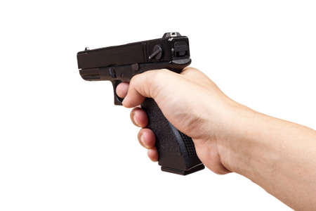 gun in hand and pointing, isolated on white backgroundの写真素材