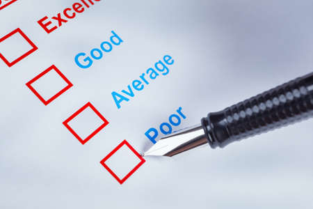 Customer satisfaction survey checkbox with rating and pen pointing at Poor, can use any business concept backgroundの写真素材