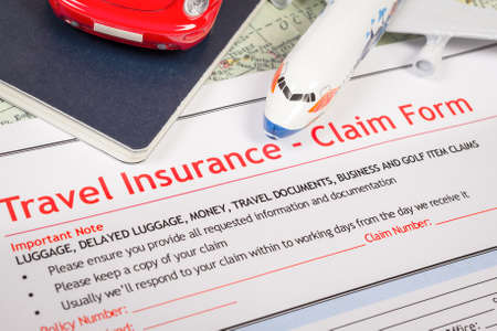 Travel Insurance Claim application form on table, business and risk concept; document,car and plane is mock-upの写真素材