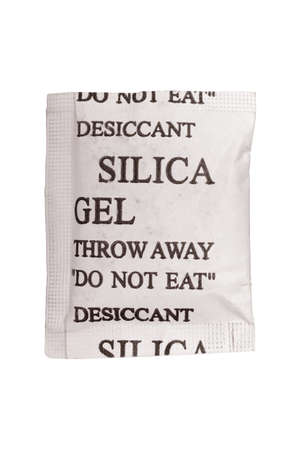 Close up silica gel or desiccant in paper bag on white backgroundの写真素材