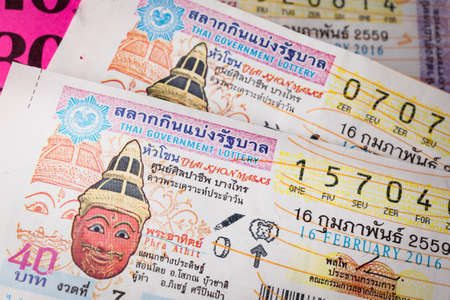 BANGKOK, THAILAND - FEBRUARY 10, 2015: Lottery ticket sold on corrugated plastic board, in the markets of Bangkok in Thailand, on February 10, 2015の写真素材