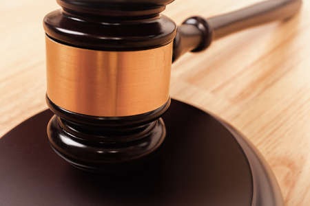 Justice hammer or judge gavel made from wooden on tableの写真素材