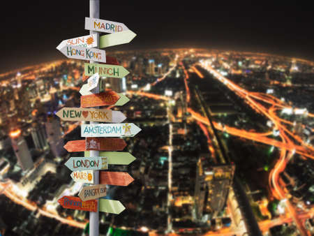 travel traffic sign and Night city skyの写真素材