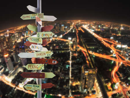 travel traffic sign and Night city skyの写真素材