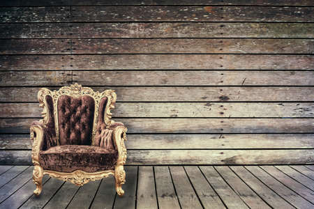 Empty vintage chair in grunge old wooden roomの写真素材