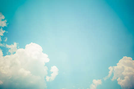 blue sky with cloud and sun rays background, vintage themeの写真素材