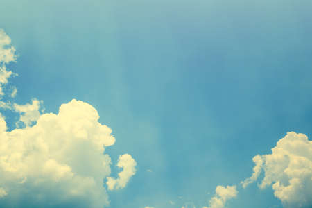 blue sky with cloud and sun rays backgroundの写真素材