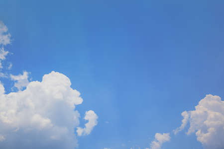blue sky with cloud and sun rays backgroundの写真素材