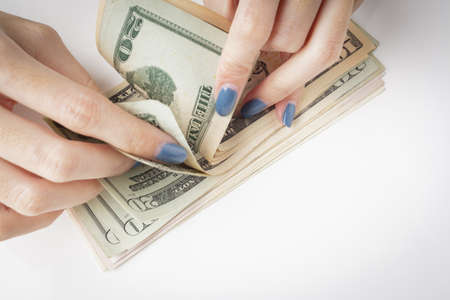 Money in the hand, Hand with money, Hand holding Banknotes and counting for give or pay bill, can use as financial or business backgroundの写真素材