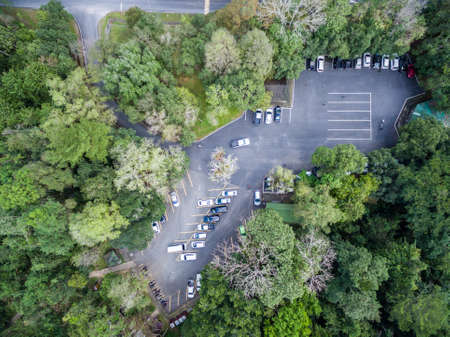 car parking in forest, shallow depth of focus, top or aerial view backgroundの写真素材