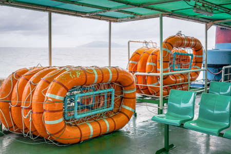 life buoy stack on ship or boat for security and safety concept backgroundの写真素材