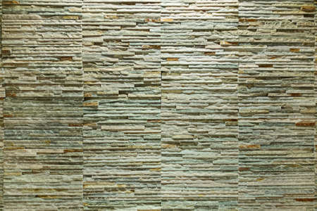 wall texture background from rock stone brick tile slate close up