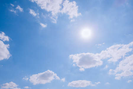 cloudy sky and blue clear sky clouds and sun backgroundの写真素材