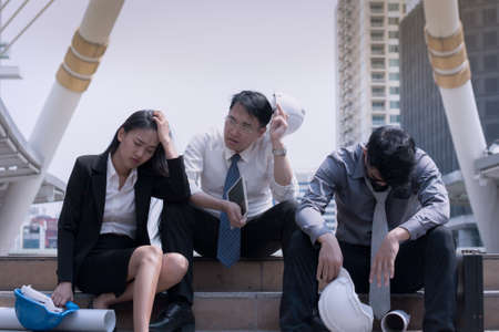 Asian businessman and woman engineer architect professional group failed or upset project plan or job their career for working business problem conceptの写真素材