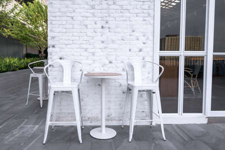 Restaurant dining table on terrace outdoor at evening timeの写真素材