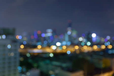 abstract defocused bokeh business cityscape area at night light sky backgroundの写真素材