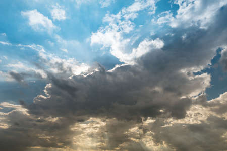 cloudy sky and blue clear sky clouds and sunburst or sun beam at twilight backgroundの写真素材