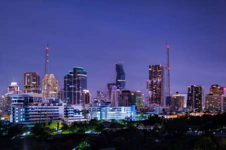 aerial view modern building business in city at dusk and night life backgroundの写真素材
