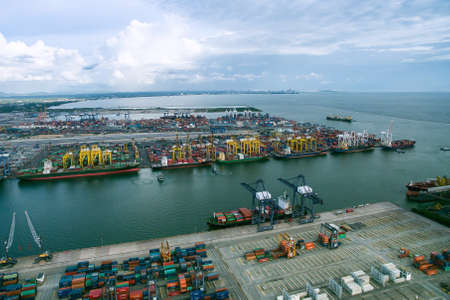container cargo ship, import export, business logistic supply chain transportation concept for shipping aerial top view backgroundの写真素材