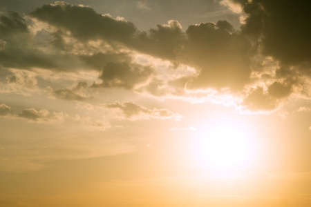 Sunlight and burst explode in cloudy blue sky clouds backgroundの写真素材