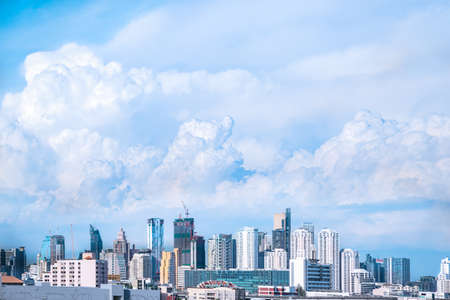 modern building in city and big blue cloudy sky backgroundの写真素材