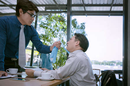 businessman fighting and disagree about business marketing in room backgroundの写真素材