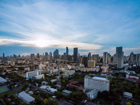 aerial view modern building business in city and big blue cloudy sky with transportation both road and river at sunset backgroundの写真素材